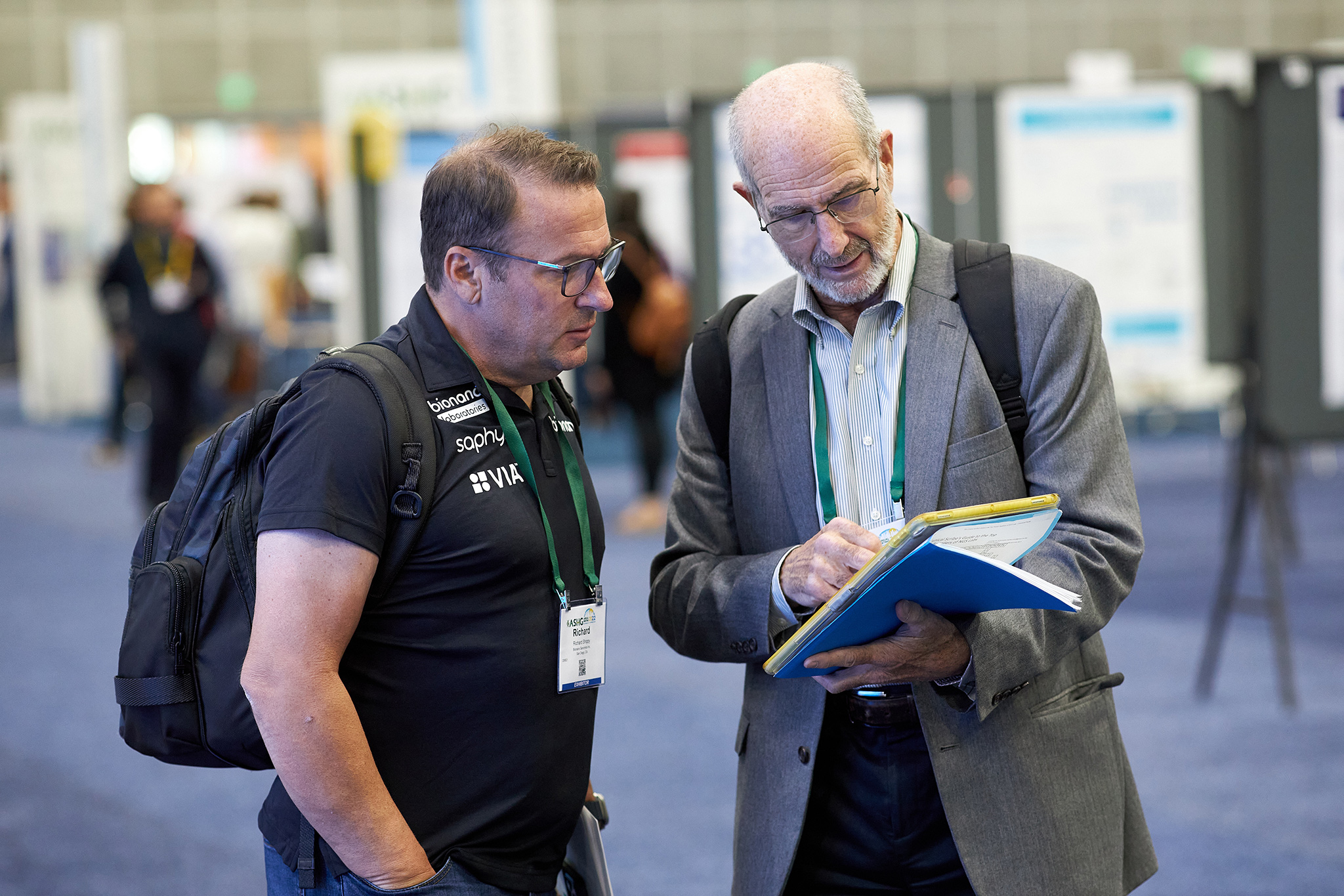 attendees speaking at event