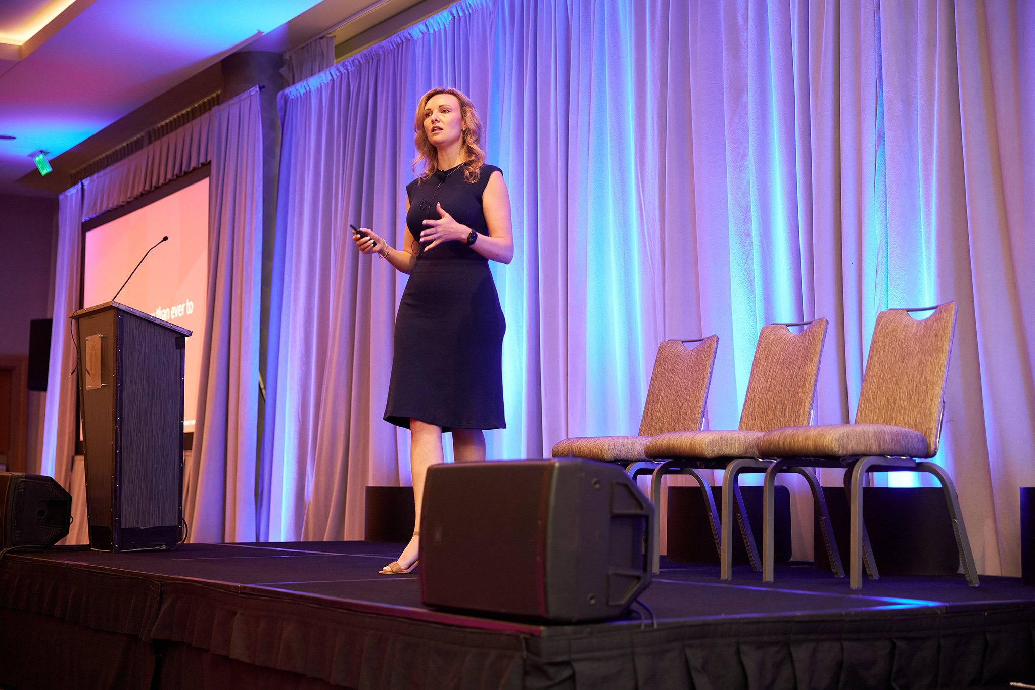 speaker on stage at corporate event