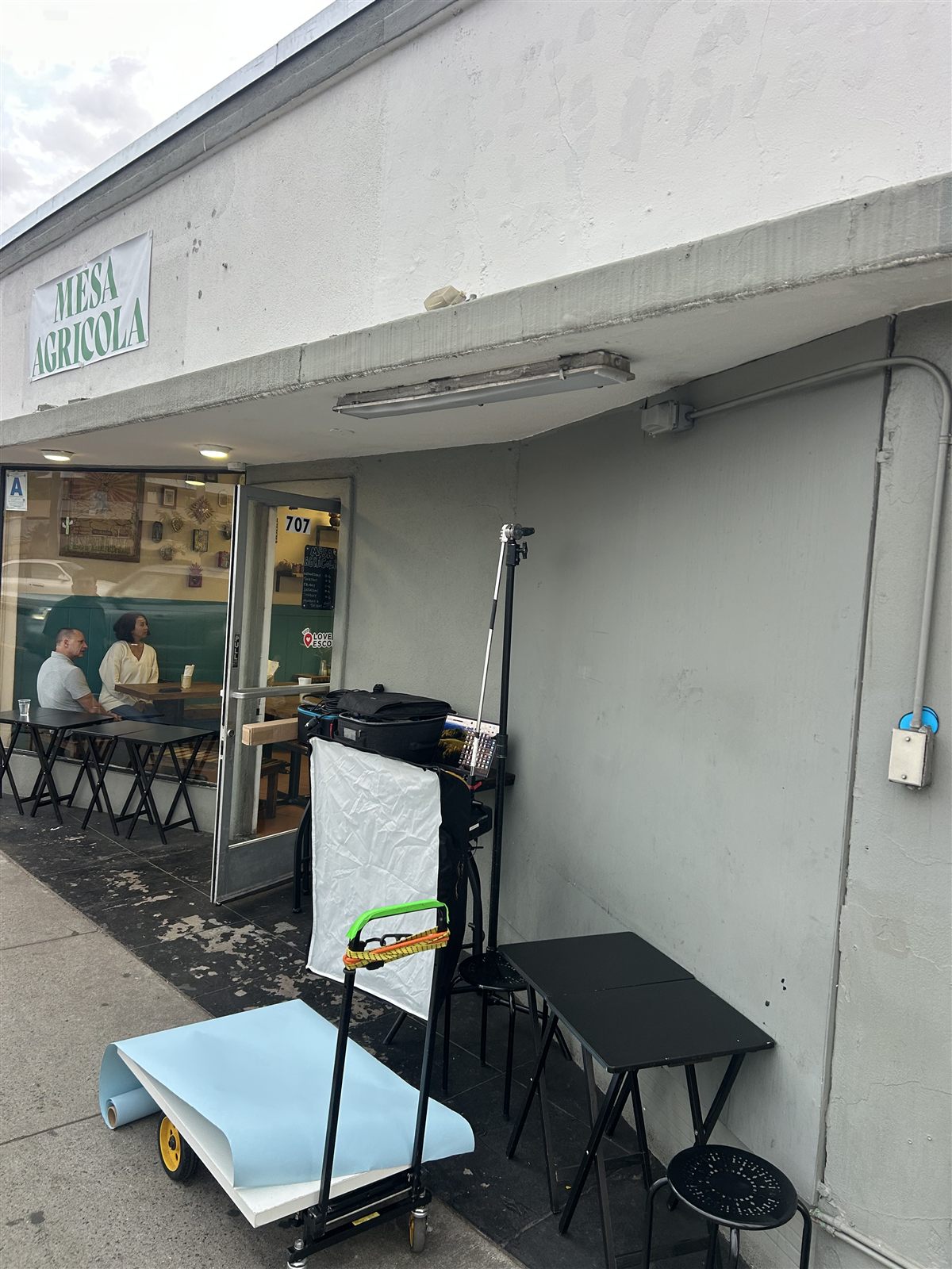 Behind the scenes: photo set built on the sidewalk outside Mesa Agricola, Escondido