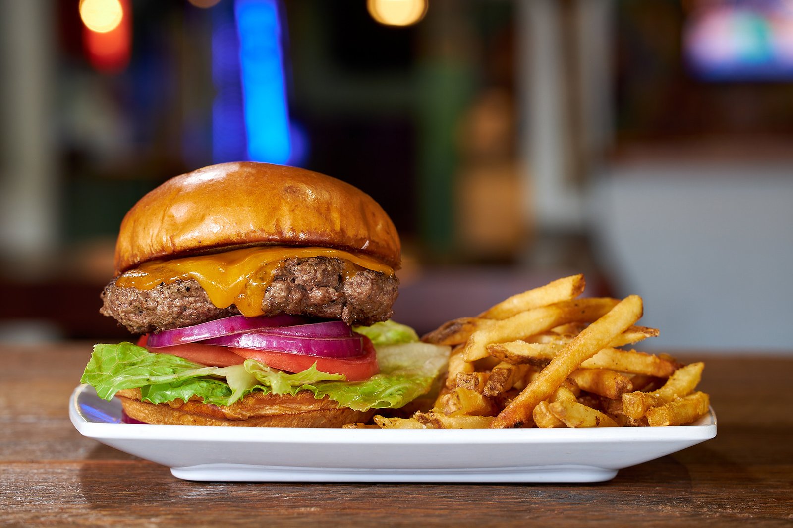 Cheeseburger with melted cheddar and fries at Paradise Grill, San Diego restaurant photography